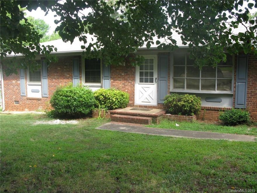 A brick ranch in an established neighborhood!  This house is priced below tax value and is "As Is".  It has a large sunken family room with an area for a home office. Nice open floor plan.   There is a large, detached 2 car garage with total 972 sq. ft., and has electrical panel and plumbing.  The upstairs has 2 carpeted rooms and drywall.    The downstairs has a room with a full bathroom in addition to the 2 garage bays.  The AC in the house has a new compressor.  Tons of potential!