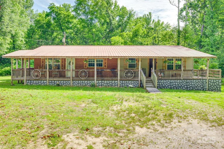 Welcome home to this cozy, cabin-style retreat nestled in the quiet countryside, but close to the convenience of Rock Hill, Indian Land, and Charlotte.  This inviting home features rich hardwood floors and charming old-world decor that exudes warmth.  The wraparound porch is a show-stopper and will invite you to sit a spell and listen to the hum of cicadas on summer evenings. If you have been looking for the simple life, come see this hidden gem.  You will feel right at home.