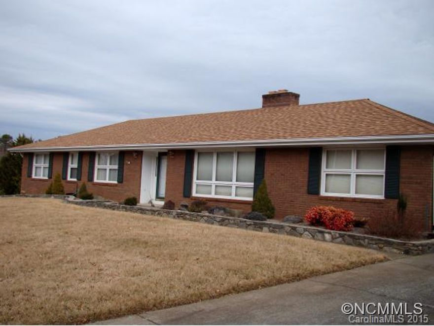 Spacious well maintained brick rancher in desirable Woodland Hills.Double driveway- to oversize dbl garage in basement or take groceries into eat in Kit.BONUS square footage(>300)in bsmnt, not counted in living space calculations: workshop + full Ba + 1/2 Bath. 2 wood burning FP's, Sunroom, Covered patio, extensive landscaping. Formal DR, LR, MBR on main.