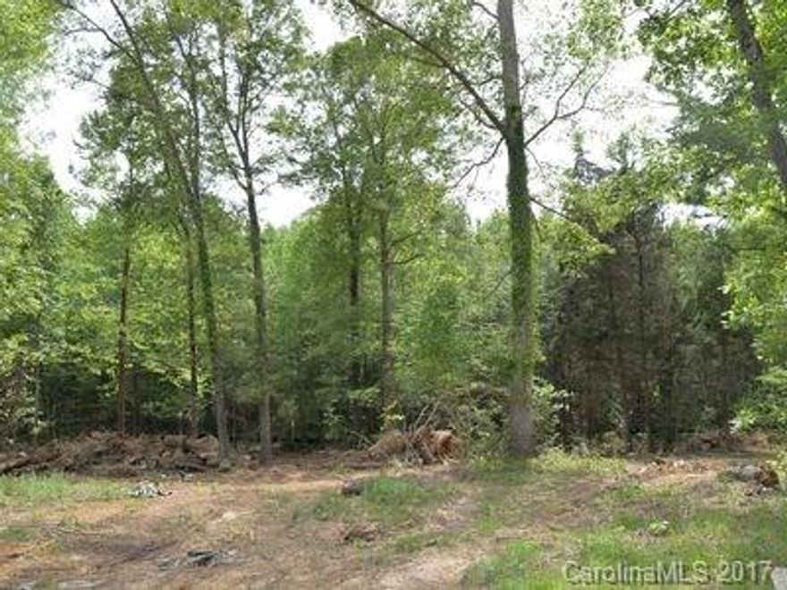 just outside Matthews city limits! Come build your dream home on open/wooded lot less than 1/2 mi. to Independence Blvd. Convenient location to uptown Charlotte. Large mature trees.