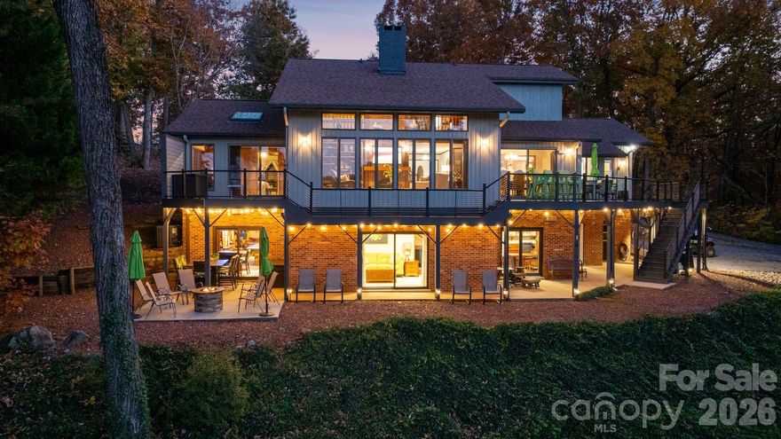 Experience luxurious lakefront living at its finest! This stunning High Rock Lake WATERFRONT residence is nestled on 1.65 beautifully landscaped acres with approx. 194’ of pristine shoreline. Offering 4BR, 3.5BA, and both a 2-car attached, and 2-car detached garage, this home perfectly blends elegance and functionality. The main level features a grand living room with fireplace, formal dining, gourmet kitchen with breakfast nook, and an impressive primary suite with bonus room and laundry. Upstairs boasts 2 spacious bedrooms and full bath. The finished basement offers a full in-law suite with kitchen, game room, den/office, and second laundry. Enjoy breathtaking lake views from multiple spaces or relax by your private pier and floater on deep, clear water. A rare opportunity for refined waterfront living! Private community boat ramp & water access. Pre-Approved Buyers Welcome!