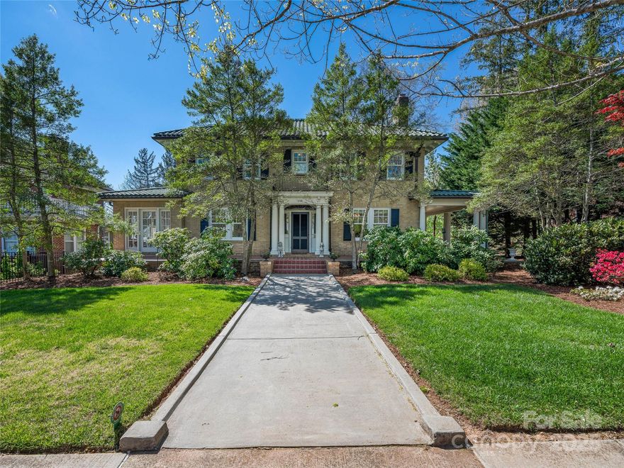 Nestled along a picturesque street in Asheville’s most iconic neighborhood, Grove Park, lies this remarkable 100-year-old, 4-bed/3-bath home. 218 Kimberly Ave blends the enduring elegance of the 20s with thoughtful modern updates. 
A classic Italian tile roof and original details evoke timeless charm, while original features such as preserved plaster walls, vintage light fixtures, and oak hardwood floors reflect age-old craftsmanship. The sunlit main level offers ample spaces to gather, featuring a cozy wood-burning fireplace.
The heart of the home is a pristine, updated eat-in kitchen with garden views & a gas fireplace. Patio doors open to a tiled veranda that stretches around the home, abutting a stunning landscaped yard.
Upstairs, 4 spacious bedrooms offer privacy and character. Downstairs, the unfinished basement provides flexibility & storage.
Just steps from the landmark Grove Park Inn, this elegant 3,444 SF home grants a rare opportunity to be a part of Asheville’s history.