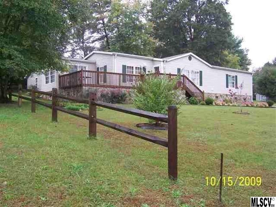 Spacious Home has Oak Cabinetry, Fire Place, Wrap Around Deck for grilling and Covered Porch/Breezeway between home and Double Detached Garage.  Kitchen has large eat in dining room and there is another Formal Dining room or Office/Den.  Master Suite has large bathroom with garden tub and shower, and Master Bedroom has a walk in Closet.  Bedroom 2 has a walk in closet also.  Appliances include Side by Side Refrigerator with water and ice in the door, range, dishwasher and microwave.  Duke Energy, City of Taylorsville Water and Sewer.  New Heat Pump in 2009, with Central Air and Central Heat.  Offering allowance to buyer of $2000.00 to use for closing costs, etc. with an acceptable offer.  FHA or VA will be accepted.  Great central location close to everything that Taylorsville has to offer.