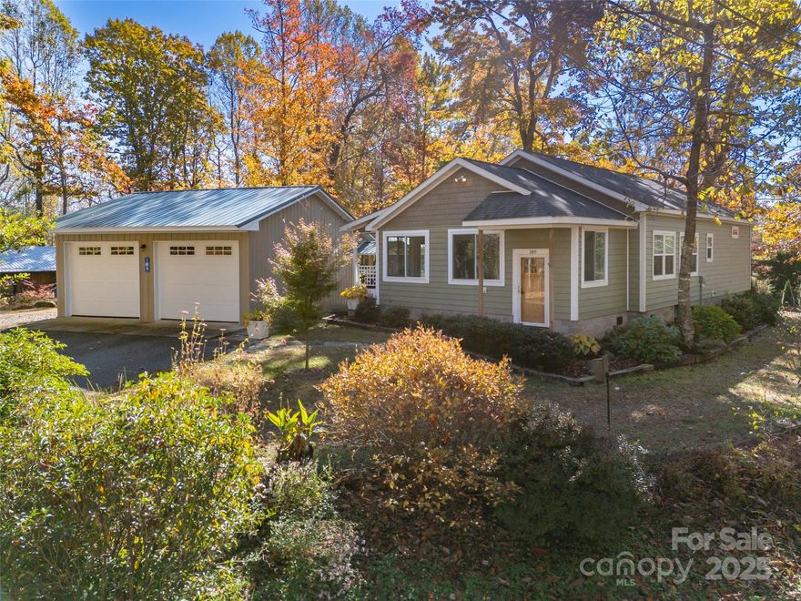 Charming Saluda Home with Workshop and One-Level Living!  Discover easy one-level living just minutes from downtown Saluda! This move-in ready 2-bedroom, 2-bath home offers comfort and convenience with a detached two-car garage featuring a dedicated workshop area—perfect for hobbies or extra storage. New HVAC! A separate shed provides even more space for tools or outdoor gear. Home equipped with generator hookup. Enjoy the peaceful setting with no HOA, while being close to the heart of town, where you’ll find local shops, dining, and mountain charm at every turn.