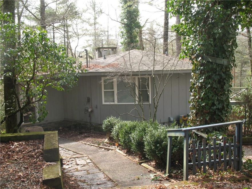 Cute Vacation Cottage or year round home! In beautiful Cashiers NC Some cosmetic improvements inside with New Floor Covering and Paint. Upper Deck and Lower Patio New Electric Heat Pump for Central Heat and Air 570/yr annual HOA fee includes Community Water  Verbal road maintenance agreement and road recently graveled and in good condition. Bank owned foreclosure Priced To Sell.