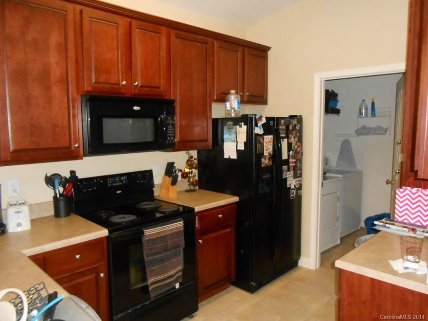 Well maintained townhouse/ condo on 2nd flr. Great floor plan, great rm w/ corner woodburning fpl, vaulted ceiling w/ access to balcony that overlooks wooded backyard. Kitchen w/ 36" cherry stained cabinets. All appl's stay. Nice master w/ vaulted ceiling. Close to all Ballantyne amenities.