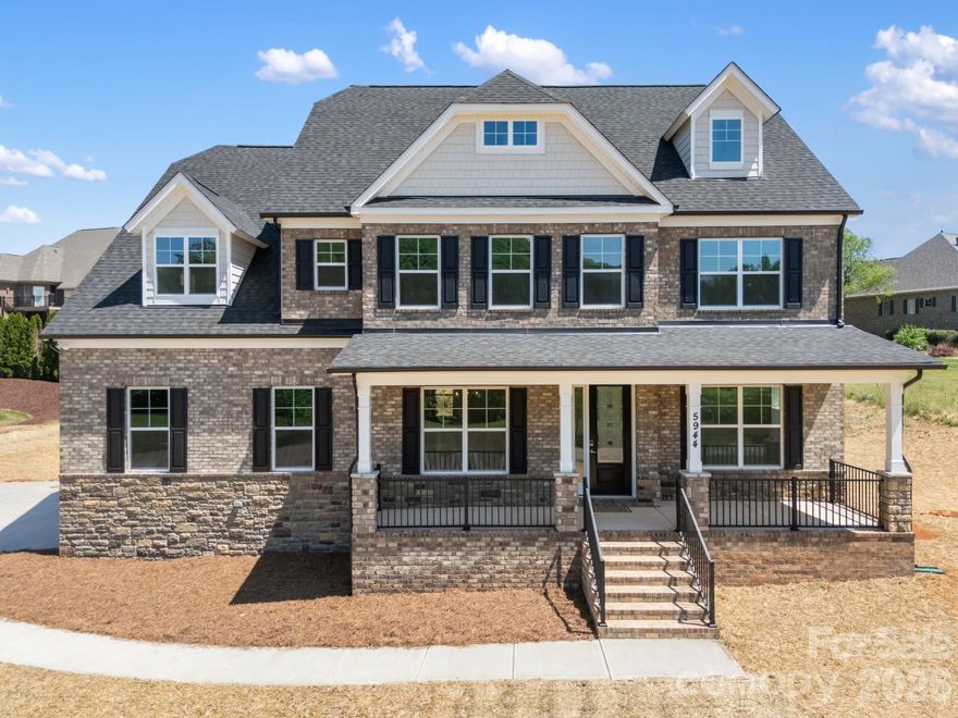 Experience refined living in this brand-new custom home located in a desirable community in Hickory. This thoughtfully designed residence offers approximately 3,953 heated square feet with 5 bedrooms and 4 full baths, combining a functional layout with modern finishes.

The main level features a well-appointed kitchen with a large quartz island, breakfast area, butler’s pantry with beverage refrigerator, and a walk-in pantry. The open living area includes a fireplace and flows into a sunroom, providing additional flexible space. A private office and guest bedroom with a full bath complete the main level.

Upstairs, the primary suite offers a spacious layout with an en-suite bath and convenient access to the laundry room. Additional bedrooms include a Jack-and-Jill bath configuration and a separate guest suite with a private bath. A loft area provides added living or recreation space.

Exterior features include a brick and stone façade, covered front porch, and a 2-car side-load garage. The property sits on approximately 0.70 acres and is located near local schools.