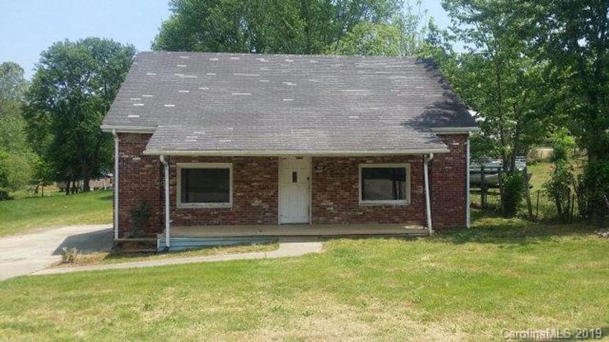 ATTENTION INVESTORS!! Great investment property with lots of potential. Home does have some foundation issues, but with very little money and work, this home could be the perfect place for you or a renter. The home has a large paved driveway and sidewalks leading up to both the front and back covered porches. Upon entering the home you will notice the size of the rooms. The kitchen has beautiful kitchen cabinets and all the appliances you need.  It  has one bedroom but has an additional room that could be used as an office. The bathroom is also very large with a large vanity but does need some work done on the flooring. Don't let this deal slip away. Priced way below tax value!! Call today for your own private showing.