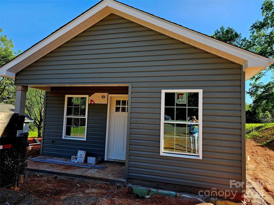 Welcome HOME to this New Construction one level home close to Lenoir Rhyne. Neighbor is a park with amenities. Enter through the covered front porch into the open concept living room with kitchen and dining room to the right. Luxury Vinyl Plank flooring throughout this modern home. Kitchen features white shaker cabinets, stainless steel appliances and granite counter tops. Bathroom excels in functionality as the primary bedroom has its own vanity accessed through a pocket door. Granite counters are in the bathroom and laundry is close by.