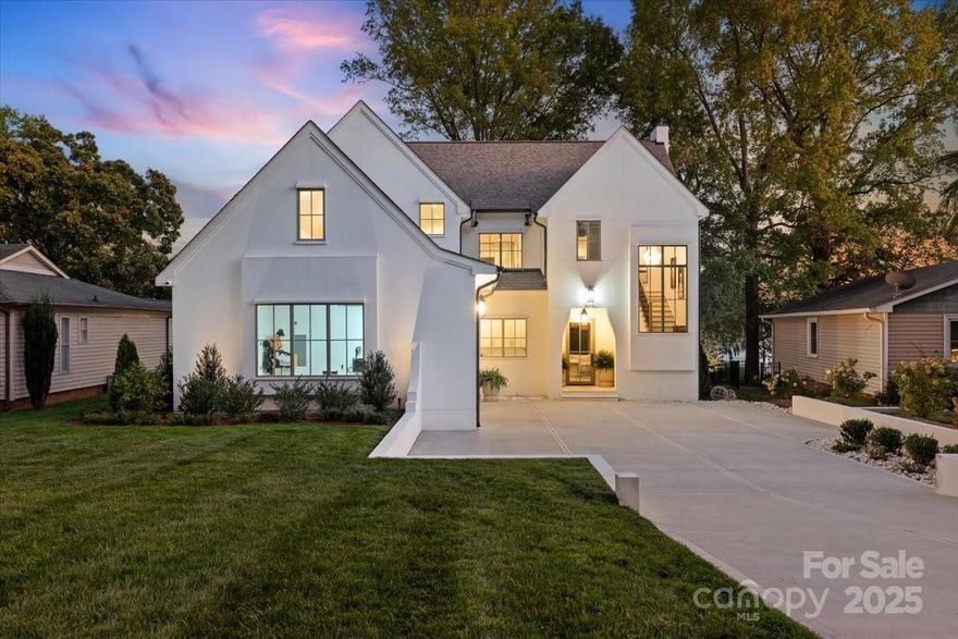 Experience lakeside luxury at its finest in this architecturally crafted Custom Home, featuring pristine shoreline and panoramic open-water views. Thoughtfully designed for both comfort and style, this residence offers a seamless blend of modern sophistication and natural beauty. An open floor plan with 10-foot ceilings and engineered white oak floors throughout creates a bright, airy flow, perfectly complemented by oversized windows and stacked sliding doors that blur the line between indoor and outdoor living.
The Gourmet Kitchen is a chef’s dream, showcasing Hi-end Monogram appliances, Walk-In Scullery/Pantry w/ additional dishwasher & sink, an oversized island with panel-ready finishes, undermount lighting, and custom cabinetry that continues throughout the home for a cohesive, elegant aesthetic.
The Primary suite, located on the main level, impresses with a vaulted ceiling, dual-zone climate control, and open water views. The Primary ensuite bath features separate oversized vanities with quartz countertops and premium fixtures, oversized walk in shower w/ dual shower heads and frameless glass, with a connection straight to the walk in closet and laundry. 
Waterfront views from the Great Room create a seamless transition to the outdoor living area. The open-concept Great Room is centered around a custom built fireplace w/ designer cast stone surround, Built-in media wall with integrated sound system, and expansive stacked sliding glass doors opening to the covered patio.  
Each Bedroom is a private retreat, featuring a walk-in closet and ensuite custom bathrooms, and an oversized loft/bonus for ultimate comfort and convenience upstairs. 
Interior living space offers Custom Lighting, Sonos whole-home audio and Eero Network system for seamless connectivity, oversized stacked sliders and windows framing a stunning water view, and custom Cabinetry and detailed Millwork throughout.
Covered outdoor living space includes Isokern ventless fireplace, In-ceiling heaters, Integrated AV system, Outdoor Kitchen featuring Bull appliances and Quartzite countertops
Additional home highlights include a whole-home AV package, offering seamless smart home integration and immersive entertainment throughout, High-Efficiency HVAC and Insulation package, Premium window and door systems for energy performance & sound reduction, Designer hardware and finishes throughout every space, and a large dropzone adjacent to the garage entrance.
From its thoughtful craftsmanship to its breathtaking views, this home redefines waterfront living — blending timeless design, modern innovation, and effortless luxury in every detail.
Lot is impervious exempt and a pool can be put in by buyers (Potential Pool Plan is in mls attachments) and the pool plan is in place with gas and electrical utilities pre-installed in the home already.