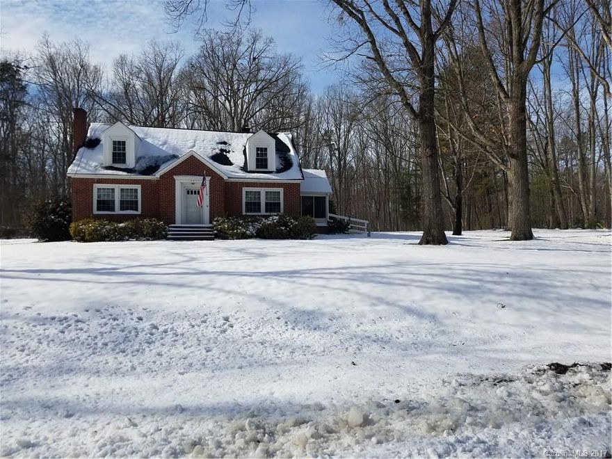 Looking for a private setting? This 3 bedroom 2 bath brick home has just that! Screened porch, 2 car carport, master down, the living room and den have fireplaces. Kitchen is updated with original built ins and upstairs has a brand new bathroom. There is a large unfinished basement and 1 acre to enjoy. Home is USDA approved.