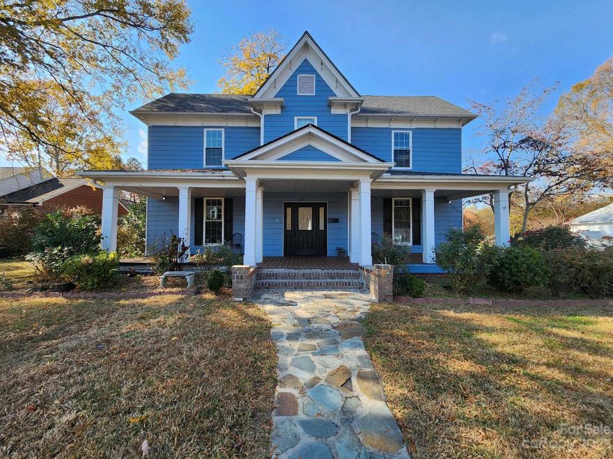 Welcome home to this charming 1905 4 bedroom 2 bath home in the Historic district of Mocksville. This home has been updated but still has it's historical charm. Large rocking chair front porch welcomes you home. As you walk through the front door the home draws you in with the massive entry, wide elegant staircase and original hard wood floors. Primary bedroom on the main floor with a large bathroom, walk in shower, tons of storage and built in vanity. 3 Large bedrooms and a full bath upstairs. The kitchen offers double ovens, pantry, lots of cabinet space, a large granite island with a gas cooktop, griddle and ample storage underneath. Large deck overlooking a spacious back yard.