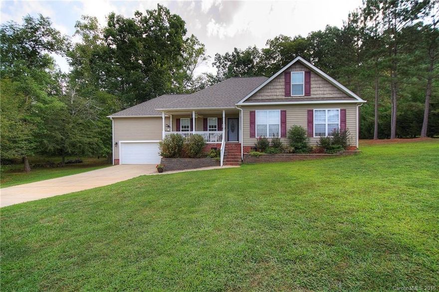 Looking for peace, serenity and relaxation?Yet close enough to enjoy shopping, dining, etc?Look no further! Nestled on 1 acre lot surrounded by trees, in a community of homes on acre+ lots.Watch the sun set from the rocking chair front porch.Spacious kitchen w/hickory cabinets, silestone countertops, tile floors & backsplash.Large master bath with garden tub, walk-in oversized shower, and dual vanities.Private, wooded backyard with plenty of space.Wired workshop.Only minutes from Dave Lyle area!