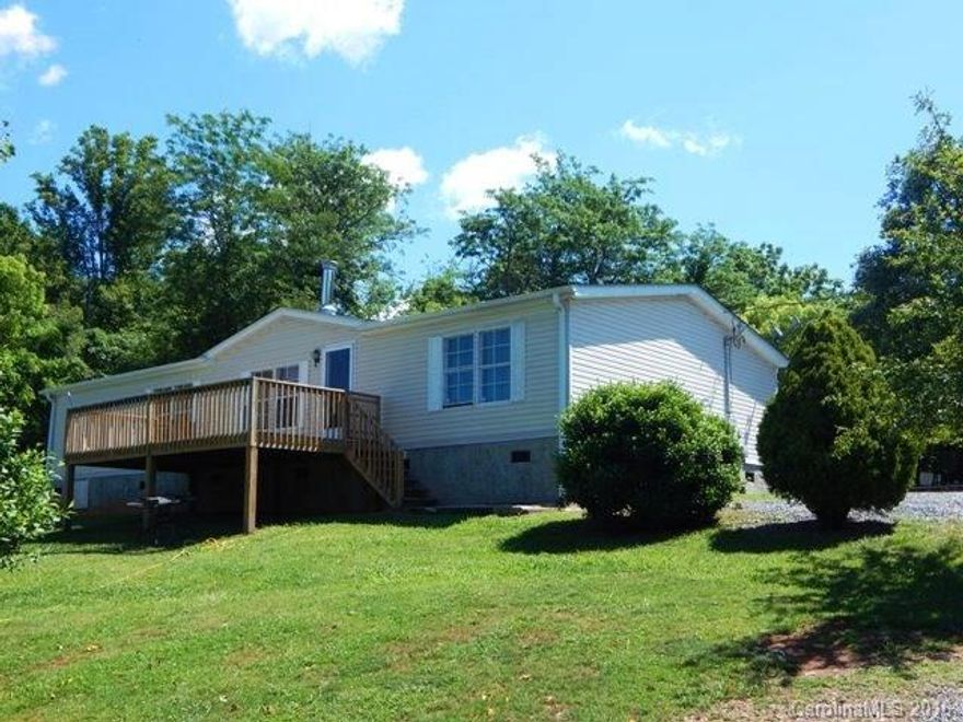 Three bedroom, 2 bath doublewide on a private .98 acre lot. Just 10 minutes to Weaverville. Sunny open floor plan, spacious eat in kitchen. Living room with gas fireplace. Huge master bath with garden tub. Relax on the private front deck. Gorgeous mtn. view with some trimming. New pressure tank and well pump in 2015, new architectural shingles in 2015, new central air/heatpump in 2015. Add your personal touch and make this house your home.