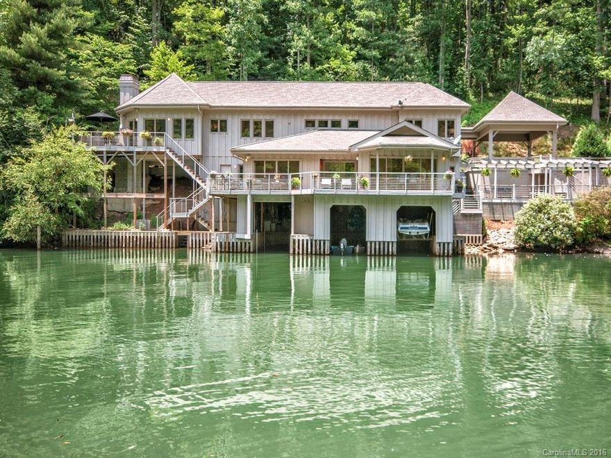 Unique custom built waterfront home featuring exquisite craftsmanship, soaring ceilings and spectacular water views. Top of the line appliances and fixtures, choice granite and marble countertops, additional multipurpose rooms, and three levels of lakefront outdoor living space. 3 boatslips, 2 with lifts.  Located at the Waters Edge of Lake Summit, a recreational lake for boating, skiing, and fishing in North Carolina.  Close to Hendersonville and Asheville. LA related to Seller.