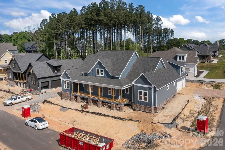 Luxury Custom Farmhouse Spec in Mills Garden at Woodstone. This beautiful new construction is set on a 0.29-acre lot and is set to be completed on 5/29/2026.  Woodstone Communities “Ironwood” is a single-story ranch, approximately 2,802 sq ft with 4 bedrooms plus an office, 3.5 baths designed with upscale finishes and a thoughtful layout. The open chef’s kitchen is built for entertaining. It features custom cabinetry, upgraded quartz countertops throughout, gourmet Z-Line gas range and appliances. This opens to your living room area that features a gas fireplace, vaulted ceilings and a huge sliding panel patio door that opens to your large, covered porch with Trex decking allowing for indoor/outdoor entertainment. The primary suite offers a huge bedroom with vaulted ceilings, spacious walk-in closet with custom built-ins and dresser drawers, and a spa-inspired bath with soaking tub and custom tilework. Additional highlights include huge plank LVP flooring, tile and carpet flooring, custom wood shelving throughout. Exterior features Hardie siding with beautiful foundation brick veneer for lasting curb appeal. Includes a huge 3-car garage, sealed crawlspace foundation equipped with a dehumidifier.