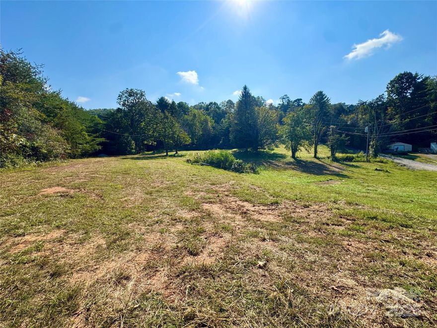 Two tracts of land totaling 2.58 acres in a GREAT LOCATION just off of Flat Creek Exit 17 in Weaverville! 5 minutes to downtown Weaverville, 15 minutes to Asheville, and centrally located in the middle of North Buncombe District schools. Potential for development, commercial options with rezoning, or ready for your dream home to be built! Upper 0.6 acres is zoned open use and lower 1.98 acres is currently zoned Residential. City water and sewer available at buyer's negotiation and expense. Seller has access to plans for 10 single family home lots or 16 townhomes. Don't wait on this prime lot to be yours!