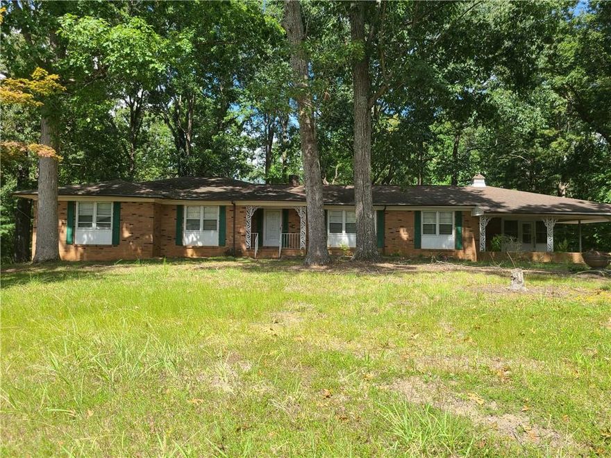 Country setting on 1.58 aces this  custom spacious Ranch with full basement. Home  Features large rooms that consist of 3Bd 2Bth on main level with Hard wood floors. Kitchen with  lots of cabinet space as well as wk/island and sep.bar as well as brkfst nook. Foyer w/cedar closet LR DR and Den w F/P with doors onto 12x24 Deck for entertaining. All bedrooms have double closets. The laundry room used to be a 4th Bdrm that was converted. Laundry could easily be put back in basement where hook ups are still there. Basement was almost finished at one time and has a partial kitchen and another family area with Fire place. Garage door entry w/workshop man cave. Front and Rear Drive ways.  New HVAC in Sept.22. This home has so much to offer.
