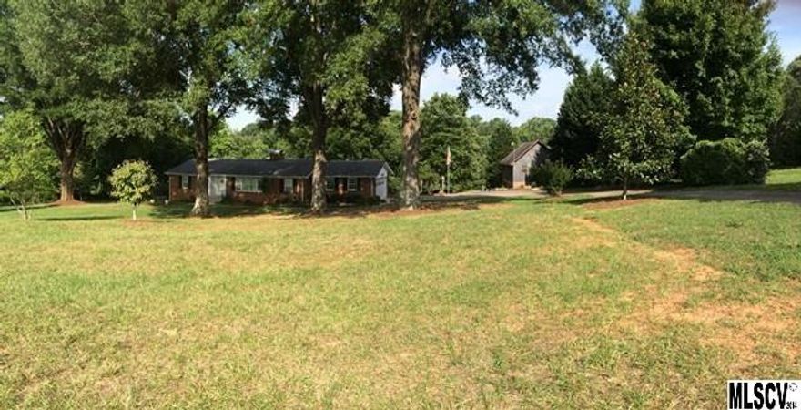 Rare find! This home has almost 5 acres of land inside of Hickory so you can enjoy the best of both worlds. 3BR.3BA brick ranch with a full partially finished basement & priced well under tax value. Features include formal DR & LR, den w/gas fireplace & beautiful hardwoods, laundry on main level, & a lovely Florida room addition w/great natural lighting offering a perfect spot to relax. Master suite on main level w/spacious bath featuring walk-in shower & whirlpool tub. Finished area in the basement offers additional den area or recreation room, full bath, bedroom as well as unheated sunroom & storage. Great scenic views from the house overlooking a pond, pasture area, Muscadine vines, & mature trees. Additional features of the property include a detached garage with upper level workshop, loft, & pole shed. You will not find another property like this one in Hickory & so close to everything!