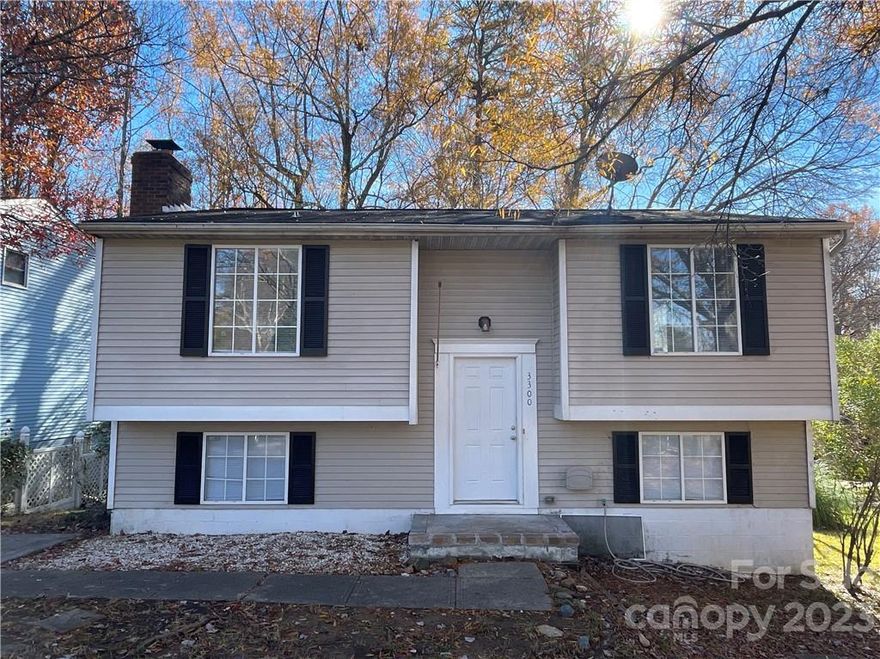 Home minutes from Independence Blvd, shopping, restaurants, and the Greenway! This Split Level home is a 3 bedrooms and 2 bath with a formal living room upstairs, main bedroom with bath and den downstairs - fireplace is not operational. Fresh neutral paint throughout with new carpet and new laminate flooring at entry and kitchen along with a new dishwasher! Access the deck from the downstairs to enjoy the outdoors - all natural area for entertaining guests. The backyard is fenced in!