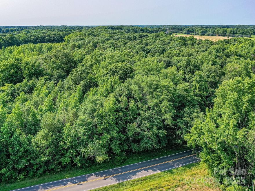 If Privacy and Woods are your dreams for a new home - this is it!  Beautiful Hardwoods ready for your beautiful oasis.  Prime location! Minutes to Hwy 74 Bypass and I 485.  Minutes to Indian Trail and Matthews but just inside Unionville township.  Road frontage is marked with pink flags on each corner.  There will be 2 additional lots across the road and will be listed in MLS as well.  Sellers would like the home built to be 2200 sq ft minimum with brick or fiber cement siding and atleast 2 car garage but open to buyers specs.  Soil work has been done and attached in MLS. Per seller there are 2 great areas for the home site.  
Call for more details. Additional lots for sale. Lot 2 is 4.57 acres/$289,000. Lot 3 is 3.11acres/ $249,900