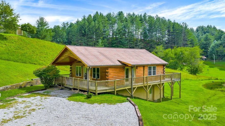 Come see this Adorable Mountain Cottage on 0.7+/- Acres with a beautiful Yard & Pond in the back yard. As you walk through the door, you will be greeted with a beautiful Living room with Vaulted Ceilings a Stone Fireplace with gas logs, Built-in cabinets, French doors to the covered porch, and an open Kitchen / Dining area. Also on the main level is the Primary Bedroom with Full Bath. The entire first floor walls and ceilings have varnished T & G Wood. Enjoy those beautiful summer evenings on the large wrap around porch having dinner or coffee in the mornings all while enjoying the wildlife passing through the yard. The unfinished basement offers unlimited opportunities, already Partially drywalled and nearly ready to finish out, full bath already in place. Walkout to a gorgeous yard where you can sit and relax while soaking up the tranquility of the Mountains! The tranquil stream that meanders to the pond is a bonus to this property. The cabin is being sold Furnished. Call today to see this awesome cabin in the Two River Country gated subdivision, which is centrally located between the quaint towns of Sparta and West Jefferson. This community has a welcoming Common Area on the New River for picnics, fishing, canoeing or kayaking.