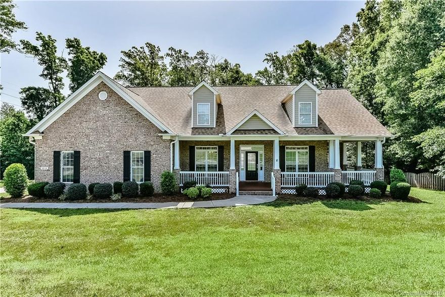 Beautiful all brick 1 1/2 story home. Hardwoods in main level living areas. Carpet in all bedrooms. Dramatic cathedral, trey or nine foot ceilings on the lower level. Formal dining room and living room or office as needed. Large kitchen plus gas cooktop, upgraded cabinets and generous counter space with sitting bar and breakfast area with bay window. Master bedroom with direct access to wrap around covered front porch. Expanded side load garage, huge back deck overlooking large fenced backyard.