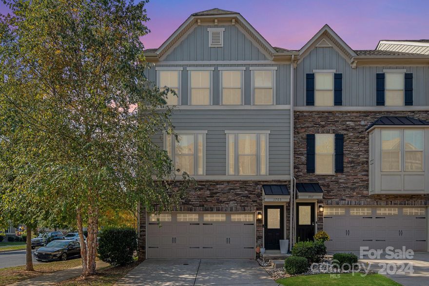 PRIME LOCATION! Discover townhome living at its finest in the sought-after Townes of Oakhurst! This beautiful like-new home features a bright, open floor plan highlighted by gorgeous white cabinetry, quartz countertops, a generous island, stainless steel appliances - including a gas range - & designer lighting. The kitchen flows seamlessly into a large, private deck, perfect for outdoor entertaining! The upper level features a large primary suite with a walk-in closet and ensuite bath, two additional bedrooms, and a conveniently located laundry room (washer/dryer can convey). The lower level includes a versatile flex/bonus room - ideal for an office or gym - and direct entry to a 2-car attached garage and additional driveway parking! Home has multiple upgrades - custom accent walls, upgraded flooring, upgraded finishes throughout, a large covered patio, etc! Walking distance to Night Swim Coffee, the gym, yoga, restaurants, and more. Easy access to Uptown, Plaza Midwood, Cotswold, etc!