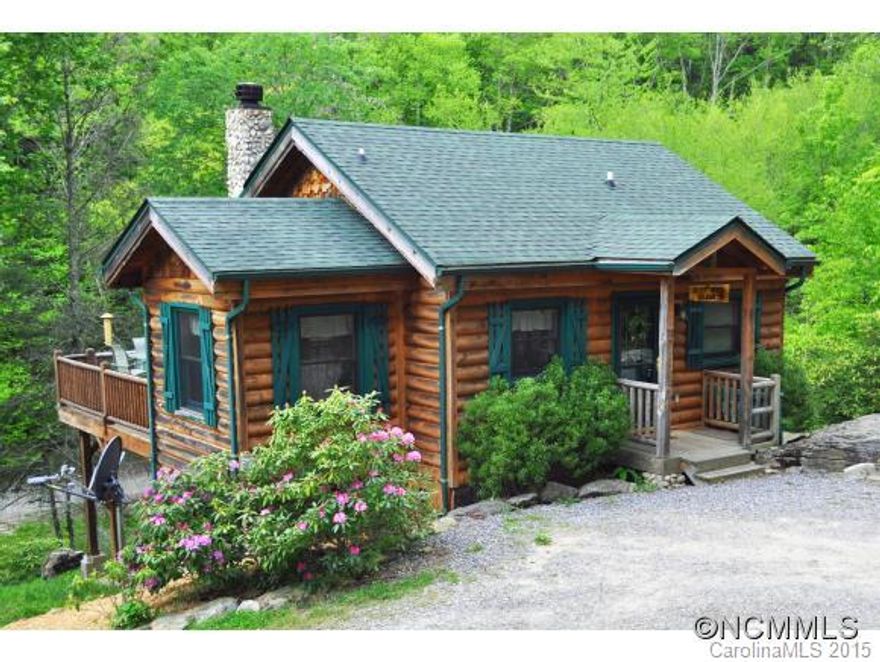 Perfect Mountain location! Just within a mile from Ski Slopes, Horse Ranch & Appalachian hiking into the Smoky Mountain Nat'l Park. 2 Bdrm/2Ba w/stone FP, on 1.4 acres, maintained Log Cabin, built just above active Fie Creek w/ 400' of creek front.  Always an excellent year round rental & close to Cherokee, Waynesville & Asheville. Sit on your deck & listen to the rushing creek or relax under the stars in your hot tub!  Sold fully furnished!