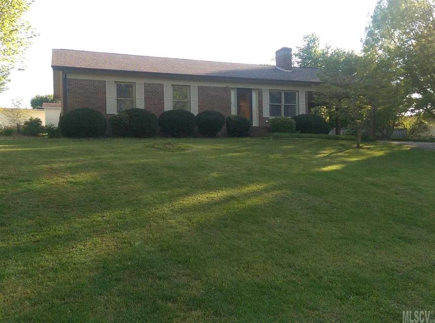 REDUCED and MOVE IN READY!.. This all brick home in Conover features 3 bedroom and 2 full baths with fresh paint throughout.  Hardwood floors, new flooring in both baths and in the master bedroom. The main living space has a very open feel which includes the living room with gas logs, dining and an island in the kitchen.  All appliances remain including a washer and dryer.  Outside features a mature landscape with a single attached carport, a large covered deck, and a storage shed. This home is only minutes from Wal-Mart, I40, and much more.  NO CITY TAXES. PRICED TO SELL!