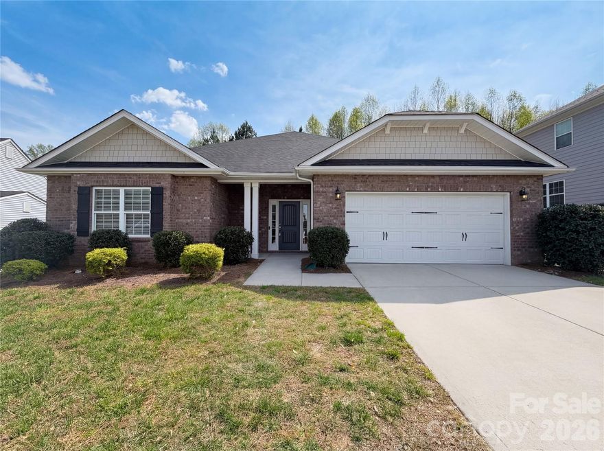 Experience 142 Allenton Way, a residence arranged for everyday living with practical features throughout. A central fireplace features in the living area, and the kitchen is equipped with a functional island and all stainless steel appliances. The primary bathroom includes both a separate tub and shower, complemented by double sinks for daily routines. Outdoor living is extended by a covered patio, creating a defined space for recreation. This property provides a well-organized layout with both indoor and outdoor utility.  Included 100-Day Home Warranty with buyer activation