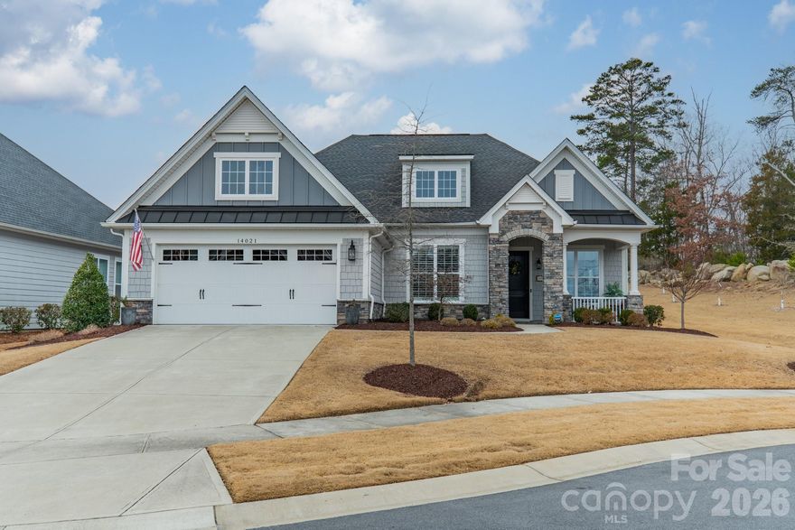 Located in the Regency at Palisades near Lake Wylie, this 2020 Toll Brothers built single level residence offers 2,300 sq. ft. of curated design and functional elegance on a 0.19 acre cul-de-sac homesite. Seasonal peek-a-boo views of Lake Wylie can be enjoyed from the front yard, with lake access, marinas and outdoor recreation just minutes away. The interior reflects a professionally curated aesthetic with layered textures and cohesive designer selections throughout. Engineered hardwood flooring spans the main living areas, complemented by upgraded lighting fixtures and custom wallpaper installations that create visual continuity from room to room. The open concept great room/family room centers around a gas fireplace and transitions seamlessly into the chef’s kitchen. An expansive center island with quartz countertops, KitchenAid appliances, a gas range and wall oven with integrated microwave anchor the space, while custom pantry cabinetry enhances organization. The kitchen overlooks the living area, supporting both everyday living and entertaining. Just off the eat-in kitchen, a private office provides a dedicated work-from-home environment with views of the backyard, offering both functionality and separation from the main living areas. Multi-sliding glass doors extend the interior to a screened sun porch with integrated lighting and ceiling fan, creating a true indoor-outdoor living experience. An additional patio beyond the porch provides expanded entertaining space and overlooks a private backyard setting. The primary suite features a tray ceiling and backyard views. The spa-style bath includes a double vanity with seated vanity station, an oversized walk-in shower and custom built-in shelving within the primary closet. Ceiling speakers, ceiling fans and custom closet build-outs further elevate functionality. Every finish has been intentionally selected to create a refined yet livable environment. The two-car garage provides practical storage and an additional 300 sq. ft. of attic space. The neighborhood offers a lifestyle centered around recreation and community, with amenities including a resort style clubhouse with bocce ball, tennis courts, swimming and activities. Landscape maintenance is included by HOA (see CC&R's). Conveniently located near Lake Wylie and within easy reach of Charlotte’s shopping and dining, this home offers design-forward living in an established community. Currently zoned for Palisades Park Elementary and Palisades Park High School.