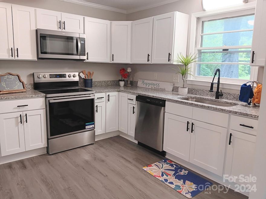 FHA ELIGIBLE. Extensive Rehab Includes NEW: SS Appliances, Disposal, 9" Undermount Sink, Granite Countertops, White Shaker Kitchen Cabinets with Soft Pull Feature, Luxury Vinyl Plank Flooring, Carpet & Pad, Vanities, Toilets, Designer Faucets, Mirrors, Lighting, Ceiling Fan, Sliding Glass Door, Storm Door, Threshold, Door Knobs, Hinges, Hardware, Supply Lines, etc. Too Much to List. Also, Fresh Paint. FHA ELIGIBLE. NO PESKY HOA TO Deal WITH. Move In Ready..!! Pet Friendly. Nice Flat Back Yard suitable for a Play Area, Swing Set, Pool, Pets, Cook Outs, Trucks, ATV's, Boats, RV's, Motorcycles, Classic Cars, etc.