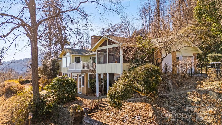 Home can be shown for backup offers. This spacious home offers 180-degree year-round mountain views from nearly every room. Situated on 2.83 acres, it features mature landscaping, a courtyard waterfall (not functioning), an inground pool, decks, patios, and a screened-in porch. The main level includes a primary suite with cedar-lined closets, two additional bedrooms, a shared bath, and a kitchen with custom pantry shelving and a pass-through to the porch. The living room boasts vaulted ceilings, large windows, and a gas log fireplace. The basement has a large living area with a Jøtul wood stove, small closet style kitchenette, sunroom, two bedrooms (one without a closet), and a full bath. Includes an additional building lot across Valley View Lane. Some TLC needed to restore this home’s full potential!