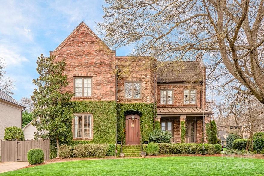 Step into this stunning Myers Park home and never leave. A perfect marriage of Old World elegance and laid-back charm, this Tudor-inspired beauty won’t last long, with its top-of-the-line finishes, perfectly-styled entertaining spaces, and modern flow on one of the most desirable streets in the Queen City. Take a stroll to Freedom Park. Admire the view wherever you turn. Kick back and relax in an outdoor space that is sure to be the envy of all. A few notable details: kitchen with large eat-in island, Dacor and Sub-Zero appliances, large bay window with farmhouse sink; rich espresso hardwoods throughout; custom wall coverings; a master suite with its own office/bonus room and seating area; professionally landscaped yard with built-in grill. No detail has been ignored. Here is a chance to make this space your own, just in time for summer.