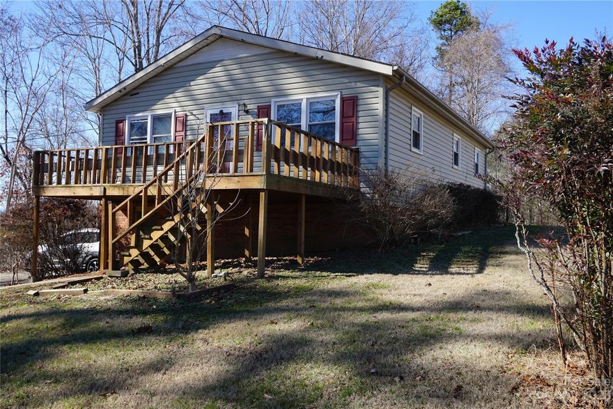 With some TLC  make this house your home. Open floor plan, in city limits of Lenoir with water and sewer, close to shopping and restaurants. Full basement has garage and enough space for workshop or hobby room. Vinyl siding, deck and area in back could be cleared for extra space in the back yard. Set up appointment today to see.