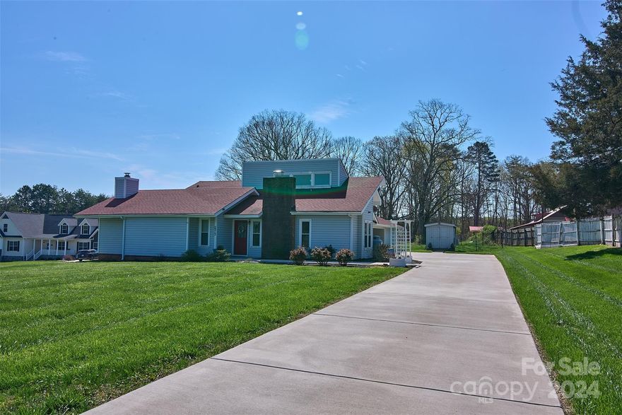 Custom built home that has been totally updated like a new home.  Large master bedroom with large bath with custom shower and a fireplace.  Three large bedrooms and a vaulted open floor plan from kitchen to great room with gas fireplace.  Newer floor coverings and kitchen and all baths redone and updated.  On demand water heaters and new hvac.  Mother in law suite has private entrance with private bath and new mini split hvac.  Workshop is also heated and cooled.  Public water and septic tank. Fenced in area in back yard for pets.  This house is better than new. It is a must see. Less than $125 per square foot.  Motivated seller