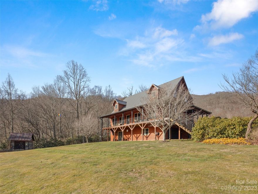 This impeccably maintained log-sided cabin embodies ideal mountain living with pastoral and mountain views from your Trex Decking front porch. The great room boasts a 2-story rock fireplace extending to the tongue-and-groove ceiling. The great room seamlessly flows to the generously sized kitchen with Corian countertops, maple cabinets & stainless steel appliances. The primary suite presents beautiful views, two walk-in closets, and a well-appointed bathroom with a jetted tub, dual vanity sinks, and a step-in shower. Upstairs, a large guest suite and spacious loft space await. Downstairs, a guest suite provides extra living space with a cozy den, fireplace, bath, new carpet, and exterior access. A 2.5-car garage offers parking for two cars and space for a golf cart, workshop, or storage space. Outside, discover an 8x10 reclaimed wood log cabin predating the Civil War. Situated on two lots totaling 2+/- acres with stunning views and a stream, you don’t want to miss this opportunity!