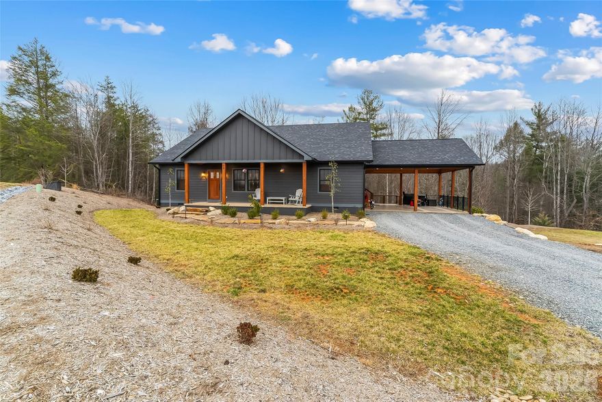 Enjoy long-range mountain views from this private retreat situated on just over 5 acres with a creek, wildlife, and established berry bushes, located just minutes from Lake James and town. This 4 bedroom home offers comfortable main-level living plus a finished basement with private entry, making it ideal for a second living space, guest suite, or entertaining area. Outdoor living shines with covered front and back porches and a beautiful fire pit area, perfect for relaxing and taking in the peaceful surroundings. The property also features a large 30x60 shop with power and water, offering excellent space for vehicles, hobbies, or storage. Inside you’ll find gas logs with a custom pecan mantle crafted by Oak Hill Iron Works, adding warmth and character to the living space. Located on a private setting with NO HOA or city taxes, this property offers both peace and convenience just minutes from Lake James.