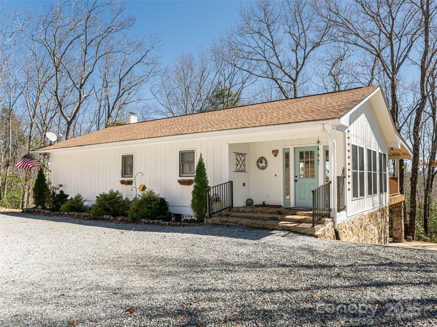 Escape to tranquility in this stunning 2-bedroom, 2-bathroom cottage nestled in the picturesque Mills River with breathtaking panoramic mountain views. plus 2 bonus rooms which serve as additional bedrooms. 
Eligible to become a thriving Airbnb, this home combines the perfect blend of cozy charm and modern comforts, making it a fantastic investment opportunity or serene getaway. The spacious living room is perfect for unwinding, and the open-concept maximizes the natural lighting. The gorgeous updated kitchen is ideal to enjoy with family or guests. Sold furnished with exceptions. The true highlight of this property is the massive covered back porch, which provides an incredible space for outdoor living and entertaining. Whether you’re sipping coffee at sunrise or enjoying dinner with friends at sunset, the mountain views will captivate you from every angle. Don't miss out on the chance to own a piece of paradise with lovely mountain views!