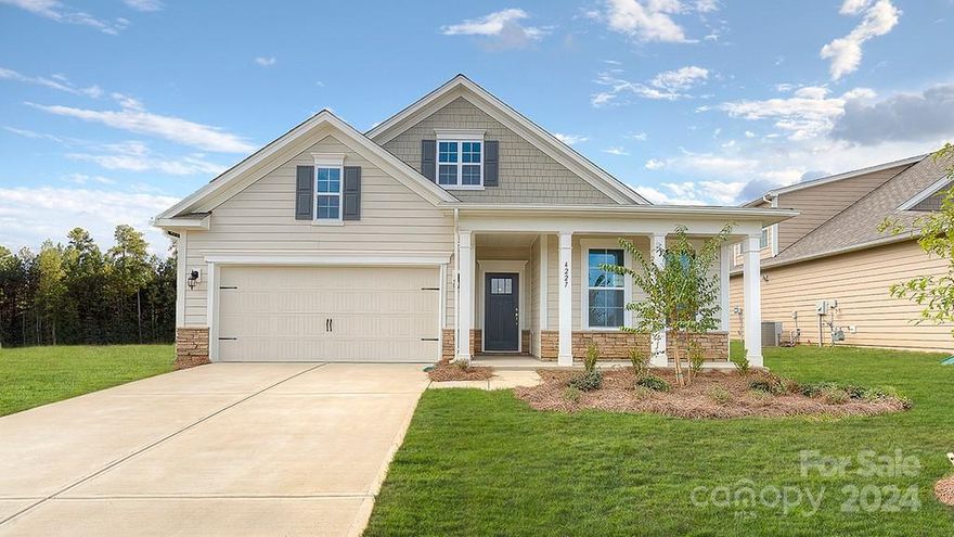 The Dover floor plan is a single story home at Cantrell Hills located on a .13 acre lot. The split bedroom floor plan includes 3 bedrooms, a flex room, 2 full baths & a 2 car garage. There is  a loft area that would make a great media room or hobby space-such potential! The kitchen is characterized by a wonderful chef's kitchen island that provides extra sitting area. The 36" cabinets are staggered & contrast tastefully w/ the tile backsplash, & granite counters. The kitchen is also equipped w/ Whirlpool SS gas range, microwave, dishwasher, & includes a kitchen exhaust vent. The 9' ceilings  have 2-piece crown molding & wainscotting in the foyer & dining area adding texture, color, warmth, & elegant interior finish. Mohawk laminate wood flooring is installed throughout the entire home except for the laundry room & bathrooms that are tiled.  10 year builder's limited warranty included & transferrable. Amenities include a clubhouse, pool, fitness room, playground, & dog park.