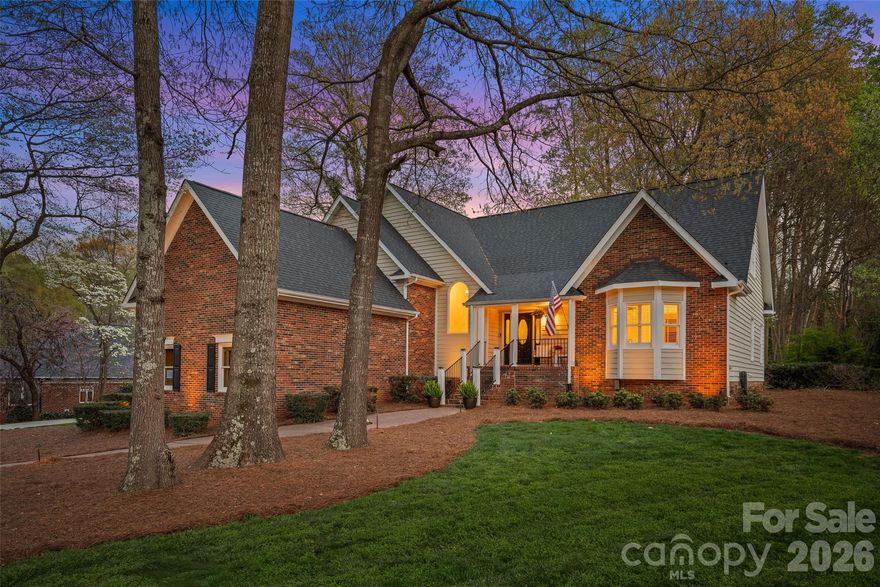 Experience elevated Lake Norman living in this impeccably maintained Langtree area home with a dedicated boat slip within walking distance—a rare opportunity in one of the area’s most sought-after communities! Perfectly positioned across from the lake, this home captures beautiful water views and a peaceful setting from its quiet cul-de-sac location, tucked within an exclusive enclave of just 26 homes. Inside, a light-filled, open layout is designed to impress with fresh paint and neutral finishes. The vaulted great room with gas fireplace creates a stunning focal point, while the kitchen is built for entertaining with double islands, an eat-in breakfast nook, and lake views that make every morning feel like a retreat. The main-level primary suite offers everyday convenience with dual walk-in closets and heated bathroom floors, while the finished walk-out basement features ample flex space, full bath, and extra-deep additional garage ideal for a workshop, storage, or hobby space. Step outside to a private, wooded backyard with room to add a pool, giving you the opportunity to create a custom outdoor oasis that complements the lake lifestyle. Plus enjoy the ease of the nearby private community boat ramp along with a serene lakeside sitting area. With a new roof (May 2025), low Iredell County taxes, quick access to I-77, and close proximity to shopping, dining, and summer concerts, this home delivers the perfect balance of luxury, location, and lifestyle!