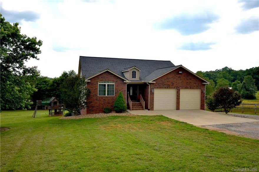 Custom built, one owner ranch home w/ full basement (finished) on 2.5 acres in western Iredell County.  Home features an open floor plan with hardwood floors in main living area (carpet in bedrs) and tiled baths.  Large open kitchen with walk in pantry, custom cherry cabinets, granite counter tops and stainless steel appliances.  Fully finished walk out basement with large living area, office (being used as bedr) and media room.  Backyard has plenty of room for a pool.  Basketball court too!!