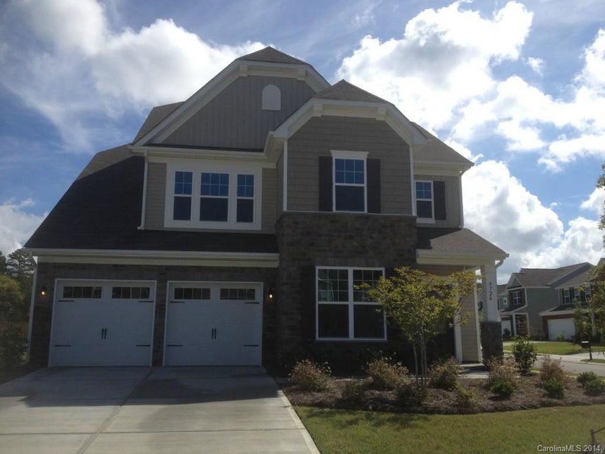 Price Reduction on this home!!!Come see this fantastic 3 story home!  It offers lots of room and all the features you would want.  Granite counter tops, hardwood floors through out the whole first floor, and ceramic tile in the bath rooms! It has a guest suite down stairs with its own full bath.  This home also has a 3rd floor with a bonus room that would be a great media room.  It is located on a corner home site!