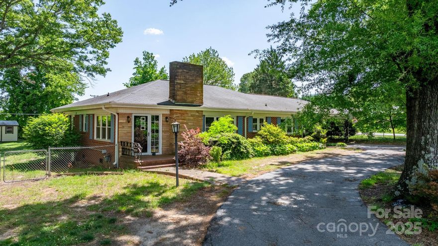 Well-maintained two bedroom, one and half baths on one acre in Snow Creek Elementary school district. The home has accents of mid-century and farmhouse-chic to provide a warm inviting feel including hardwood flooring in the LR and bedrooms. The privacy of your own little oasis, close to the hustle and bustle of the Springs Road/ St. Stephens with restaurants and shopping. Beautiful trees providing shade with two sheds (with electricity) for your hobbies, storage, or hang-out spot. This yard provides a quality accommodations for your feathered friends with divided shelter for any baby chicks that might come along. Gas log fireplace, knotty pine paneled den or office space, and the primary bedroom has an ensuite half bath. Large "walk-in" closets unique to a home built at this time, providing organized storage. New gutters and water heater in 2022, provide piece of mine for this step in your life. One hour drive to Charlotte International Airport.