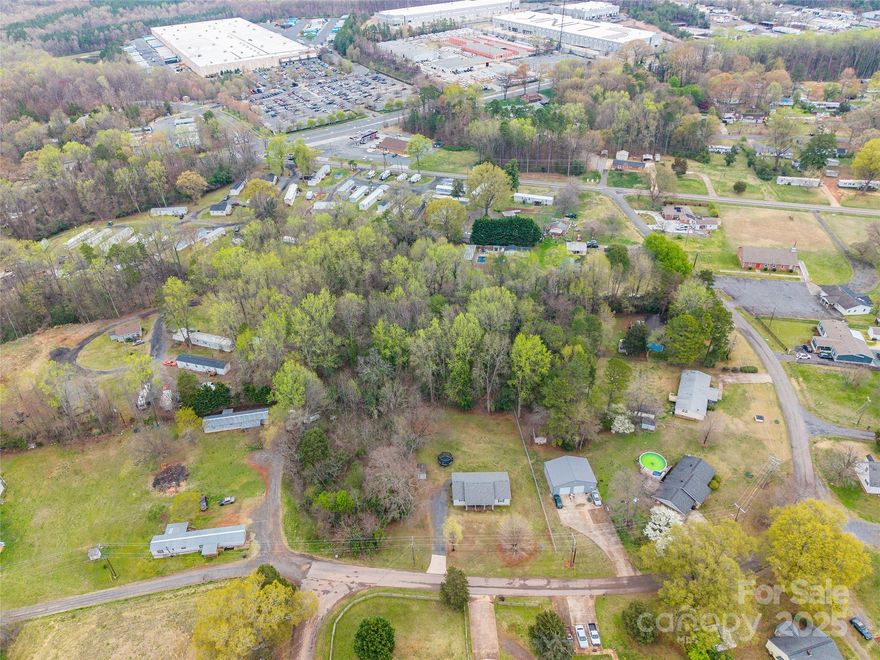 Prime Investment Opportunity: 3-Parcels on Brickyard Road, Charlotte. An excellent opportunity to acquire three adjacent parcels located at 4118, 4124, and 4140. The combined acreage totals approximately 2.21 acres. Conveniently located with easy access to Interstates 85 and 485, these parcels offer a strategic location near major transportation routes. The properties are also close to popular attractions such as Charlotte Douglas International Airport, Charlotte Premium Outlets, and the U.S. National Whitewater Center, providing added convenience for future residents or tenants. This offering presents a promising opportunity for investors or developers looking to maximize the potential of land in a growing area of Charlotte.