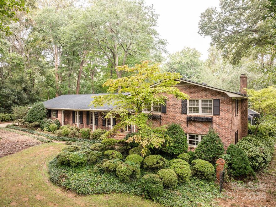 Discover this one-of-a-kind, all brick split-level home in one of Rock Hill's most desirable subdivisions, Cato Estates. Offering endless potential on 1.57 acres, which includes a .48-acre adjoining lot. The main level features 3 bedrooms, 2.5 baths, a cozy family room with a large fireplace, living room, dining room, and an enclosed porch. The kitchen was updated within the last 10 years with granite counters & tons of cabinet space. The original bathrooms provide an opportunity to add your personal touch. The finished basement adds extra living space with 2 bedrooms, a full bath, and a den with a fireplace. Step outside to your resort-like backyard with a full fence, in-ground pool, spa with spillover, & expansive decking with covered areas perfect for entertaining. The 2nd living quarters include a bedroom, 2 full baths, a full kitchen, & living area—ideal for guests or income potential. Don’t miss this rare gem that must be seen in person to fully appreciate all it has to offer!