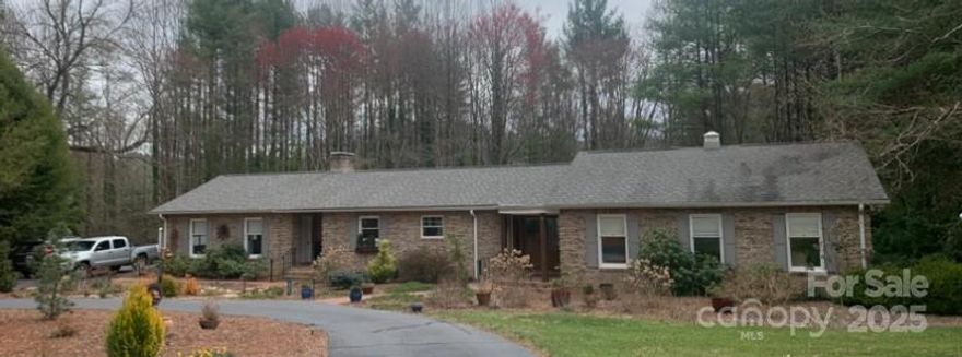 Prime location in desirable Woodhaven, one of Henderson County’s quietest and most picturesque neighborhoods. This beautiful one level open floor plan ranch is nestled on .89 acres in the historic Village of Flat Rock.
The gourmet kitchen features Italian marble countertops, soft close cabinets with under mount lighting, and a massive 8 foot island that houses a dual fuel Bertazzoni range.
The main living area features wide plank hardwood floors throughout, plus gorgeous views through expansive windows that run the entire backside of the home. The master suite also opens onto a huge 800 square-foot covered deck that offers panoramic views of the wooded property.
Woven cordless shades with blackout lining are found in all bedrooms and bathrooms. Bathrooms feature custom tiled showers and floors, granite countertops, and beautiful cabinetry.

This 2460 square-foot home includes a 17 kW Generac generator and dual water heaters to handle the bathrooms and kitchen/laundry separately.