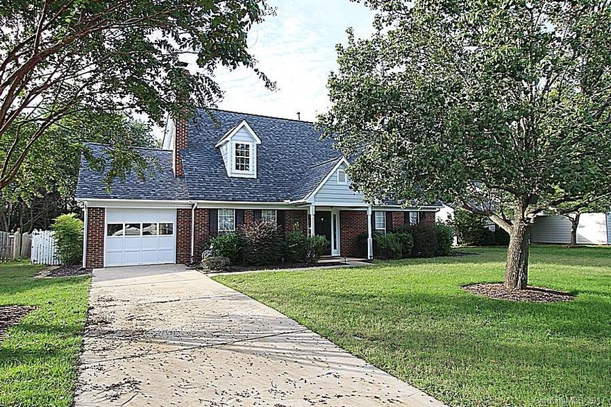 Walk to shopping & dining at Blakeney! Updated Cape Cod w/vaulted ceilings, wood/tile floors, & 1st-floor master. FR w/fireplace open to 2nd-floor loft. Kitchen w/granite counters, refin cabinetry & breakfast area. Private fenced backyard w/2 patio spaces & pergola. Master suite w/beautifully-remodeled bath w/stylish mirrors, subway & mosaic tile, and frameless shower, modern tub & dual-sink vanity w/custom granite counters & storage. Upstairs BRs & bath.