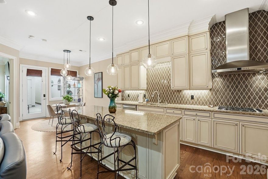 This highly desirable Ardrey Commons Townhome welcomes you with a charming covered front porch. Inside, the main level features a spacious primary suite offering comfort and privacy, complete with two walk-in closets and an elegant bathroom showcasing a dual vanity, soaking garden tub, frameless glass shower, and a private toilet area.
The main floor boasts an open-concept layout connecting the kitchen, breakfast and family room, highlighted by 10-foot ceilings, a cozy fireplace, and floor-to-ceiling cabinetry in the kitchen. The kitchen island includes a built-in wine fridge and stylish pendant lighting, making it a perfect space for any home chef. A walk-in pantry conveniently houses the washer and dryer as well and a half bathroom is located just off the kitchen area. The large formal dining room offers plenty of space for entertaining, while a separate breakfast area allows for casual, everyday dining.
Hardwood floors complete most of the main level of the house. The master bedroom has carpet while the bathroom suite has ceramic tile.

From the kitchen, step out to a private stamped-concrete patio featuring a remote-controlled awning and gas grill, ideal for outdoor relaxation or gatherings. It's a perfect place for you to enjoy quiet mornings with a cup of java or tea with complete privacy!

Upstairs, you'll find three bedrooms, including a second potential primary suite, plus two additional versatile rooms—perfect for guests, family, or a home office. A second full bathroom and a large storage room complete the upper level. Most of the upstairs has carpet.

Outside, the community offers tree-lined streets, sidewalks, and street lighting, creating a picturesque and walkable neighborhood environment.

**We will require a 2 hour window for an appointment since the owners will have to take the dog out of the house.